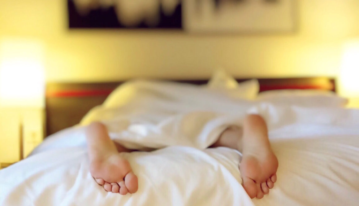 Canva - Person Lying on Bed Covering White Blanket